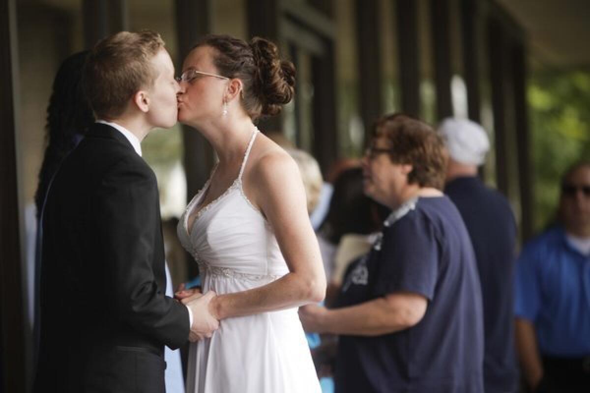 Amy and Lorelei Transgrud wait in line in Norwalk to get married.