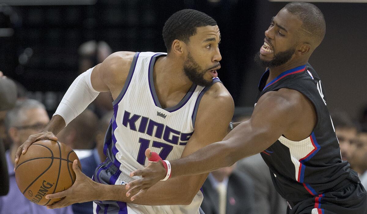 Sacramento Kings guard Garrett Temple, left, keeps the ball away from Clippers guard Chris Paul during the first quarter in an NBA preseason game on Oct. 18.