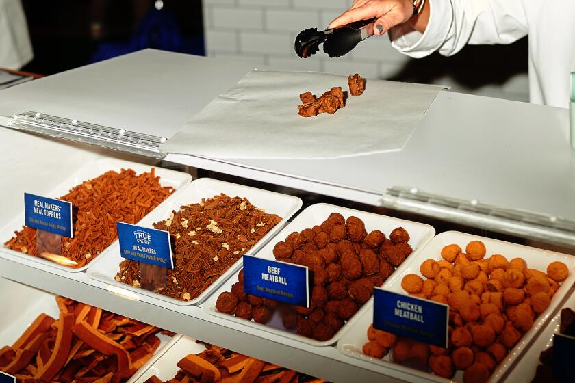 Blue Buffalo's dog treat delicatessen serves treats to attendees at the Global Pet Expo on Wednesday, February 26, 2020 at the Orange County Convention Center in Orlando, Florida. (Zack Wittman for the Los Angeles Times)