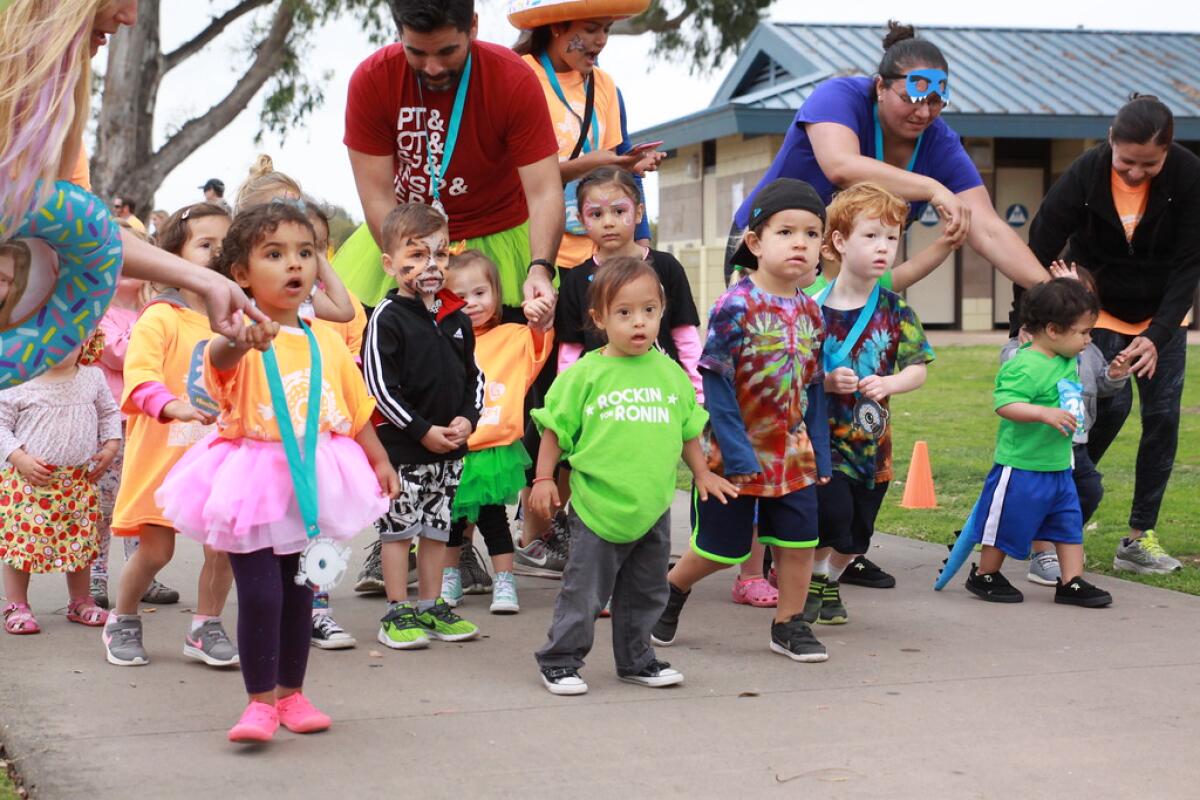 Participants run in GiGi's Playhouse San Diego's San Diego Donut Run 2018.