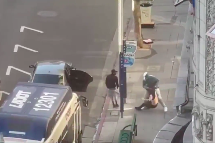 Video footage shows a suspect grappling with a man he robbed, according to police