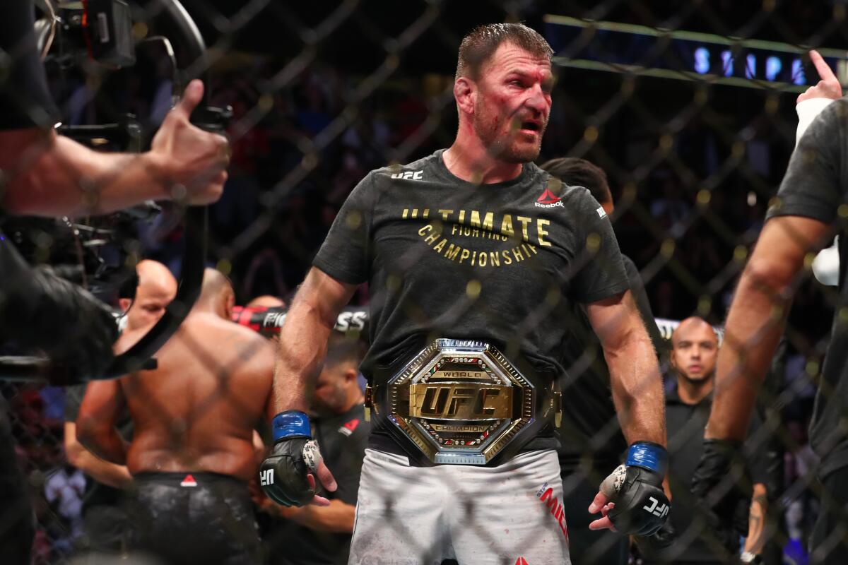 Stipe Miocic celebrates his win over Daniel Cormier after their UFC Heavyweight Title Bout at UFC 241 at Honda Center on Saturday.