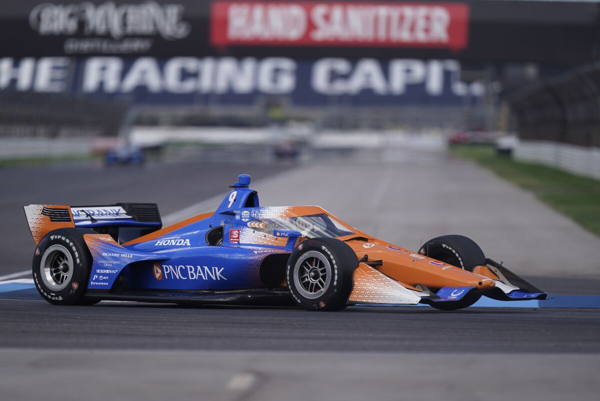 Scott Dixon, of New Zealand, steers his car during a practice session for an IndyCar auto race at Indianapolis Motor Speedway, Thursday, Oct. 1, 2020, in Indianapolis. (AP Photo/Darron Cummings)