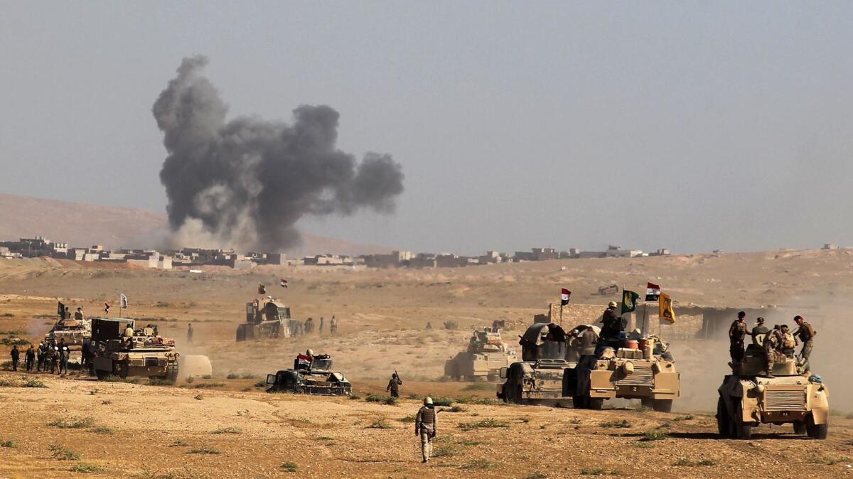 Iraqi forces advance toward Tall Afar in an offensive to retake it from Islamic State in August 2017.