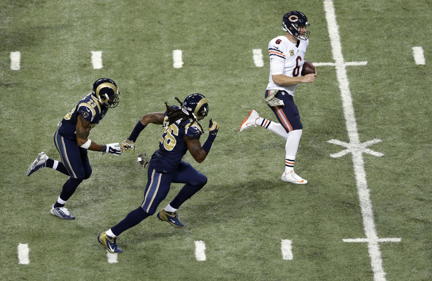 Jay Cutler runs with the ball as the Rams' Rodney McLeod and Mark Barron give chase during the third quarter.