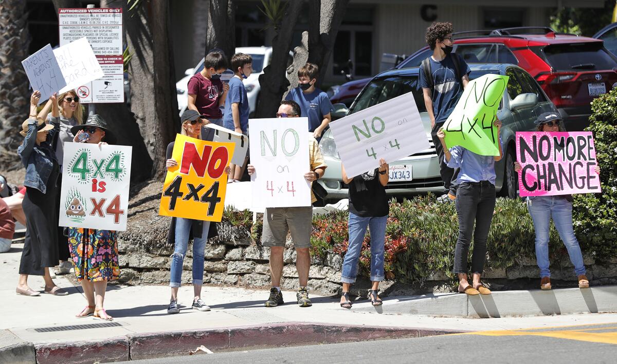 Parents and students demonstrate along Park Avenue outside Laguna Beach High on Friday.