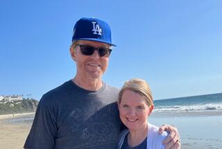 Todd Sand and wife Jenni Meno on the beach.