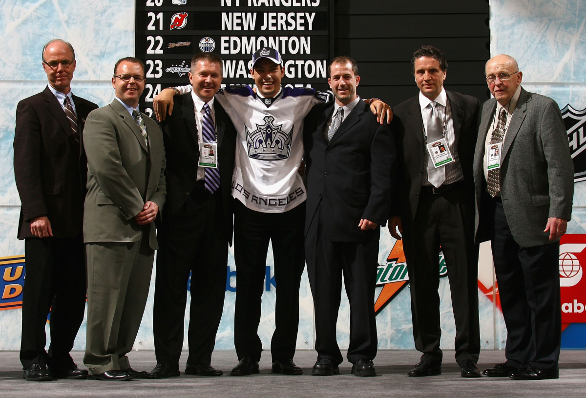 Drew Doughty poses for photos with Kings personnel after being selected No. 2 overall in the 2008 NHL draft.