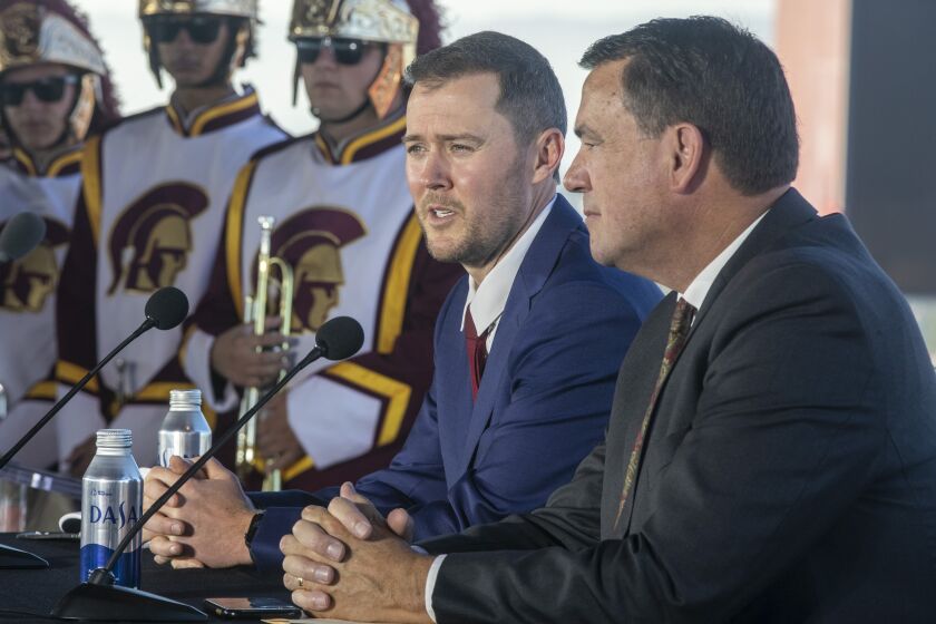 LOS ANGELES, CA - November 29 2021: New USC head football coach Lincoln Riley, left, and USC Athletic Director.