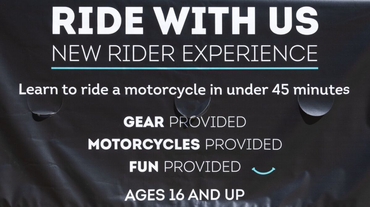 'Ride With Us' banner