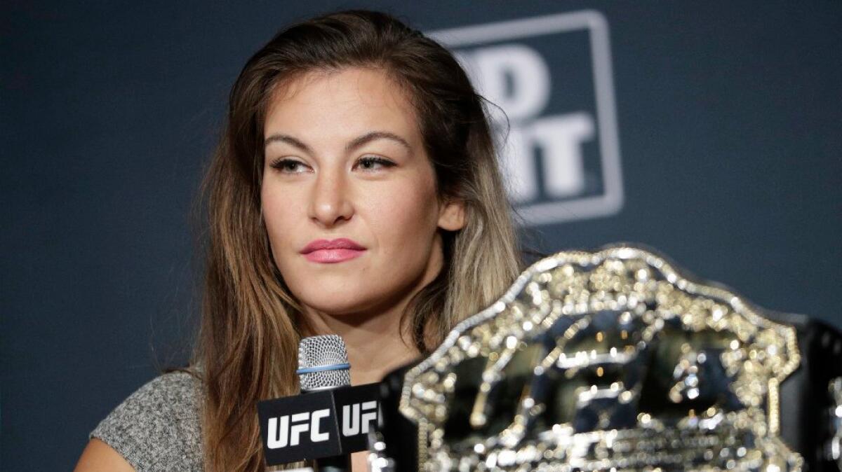 UFC bantamweight champion Miesha Tate answers questions during a news conference on July 6 ahead of UFC 200.
