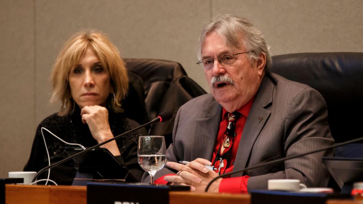 CalPERS board member J.J. Jelincic, right, during a board meeting in December. Fellow member Dana Hollinger is at left.