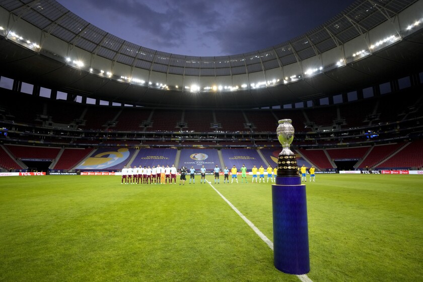 The Copa America trophy is placed on the field prior to the opening match between Brazil and Venezuela at National Stadium in Brasilia, Brazil, Sunday, June 13, 2021. (AP Photo/Ricardo Mazalan)