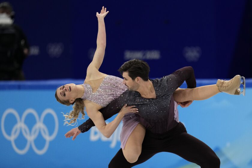 Madison Hubbell and Zachary Donohue, of the United States, perform their routine.