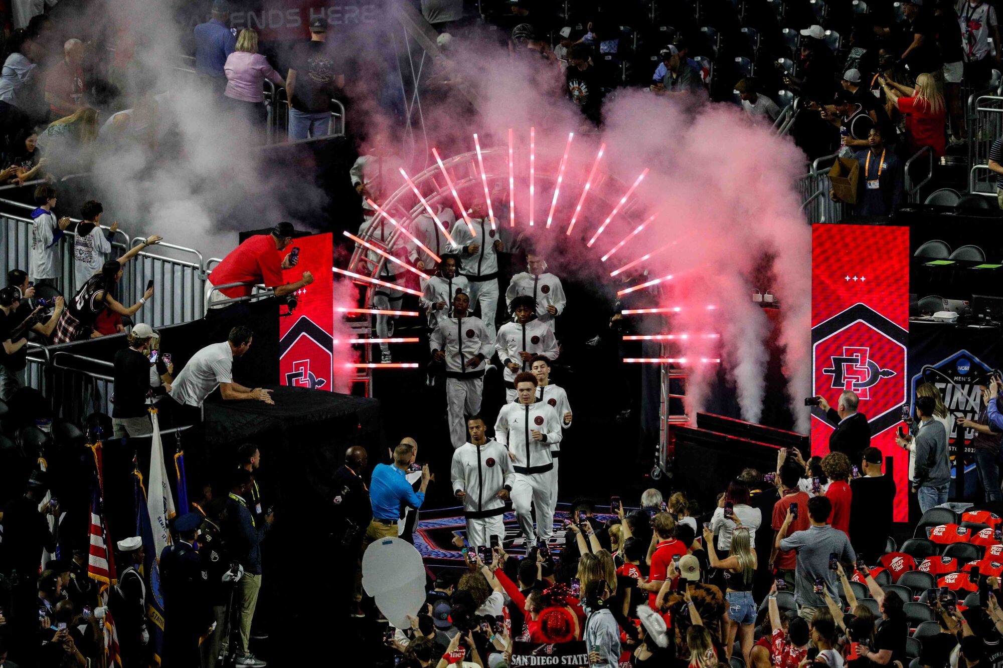 San Diego State players run onto the court before a game