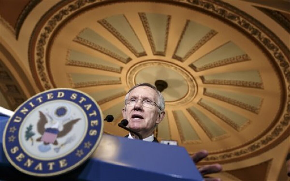 Harry Reid is shown against a dramatic ceiling on Capitol Hill. 