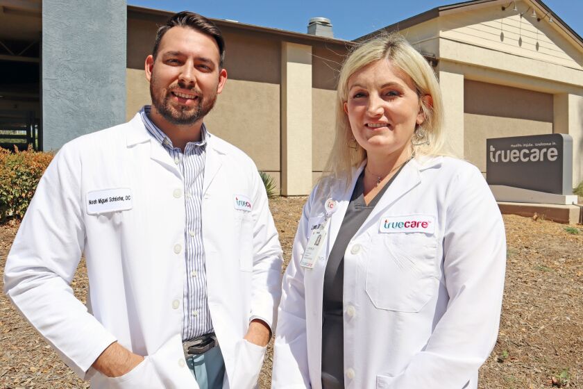 Chiropractors Dr. Noah Schriefer and Dr. Jennifer Lovern serve patients at TrueCare, a community health center in Ramona.