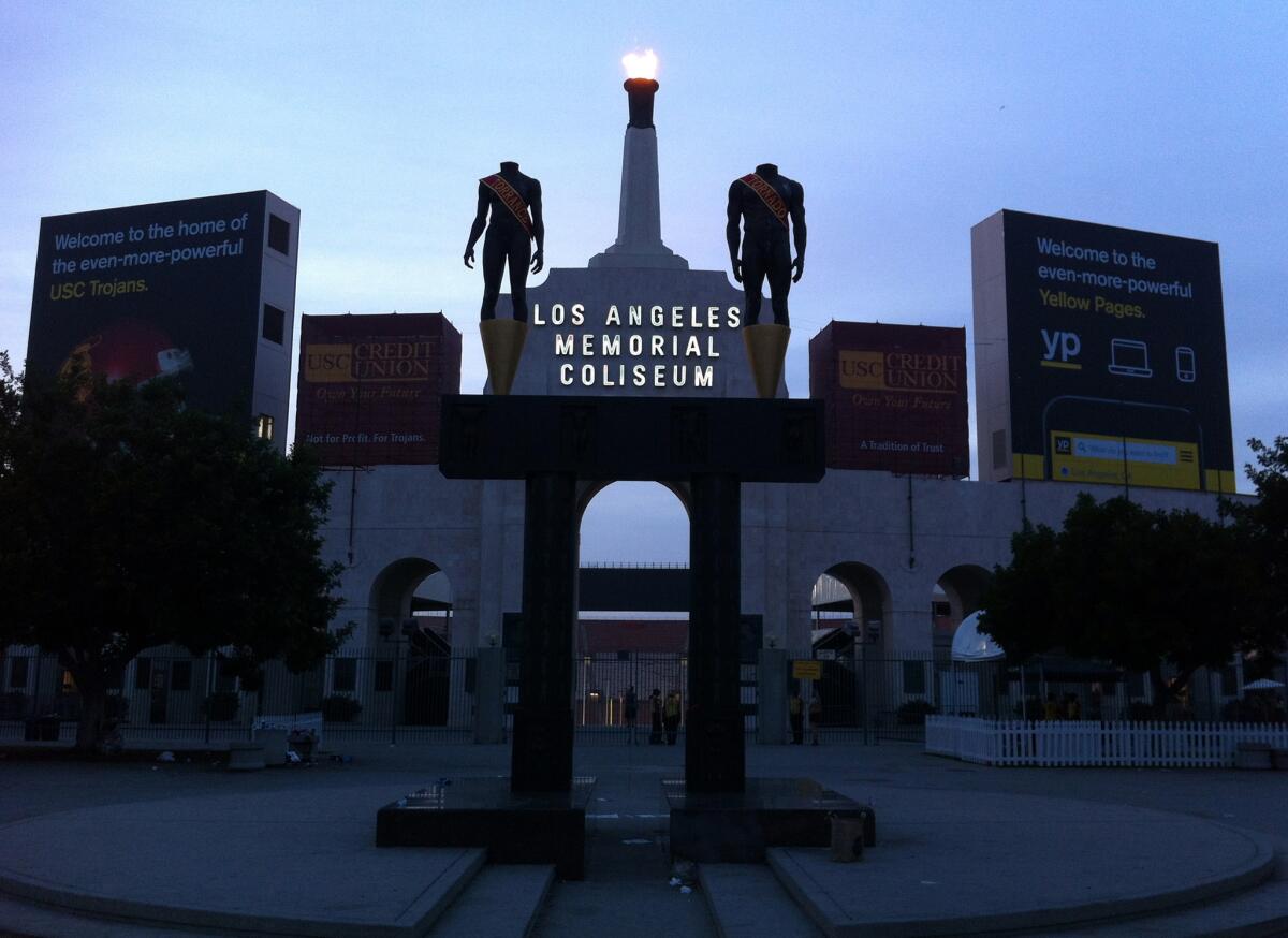 This photo taken Nov. 29, 2014, shows the facade of the Los Angeles Memorial Coliseum in Los Angeles. The U.S. Olympic Committee on Tuesday, Sept. 1, 2015, named Los Angeles as its candidate for the 2024 Games, replacing Boston's soured bid and marking a comeback for LA's dream of becoming a three-time host of the global sports competition. (AP Photo/John Antzczak)
