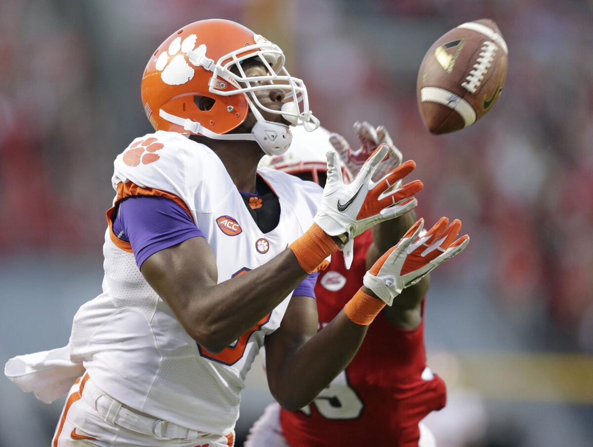 Clemson's Deon Cain catches a touchdown pass as North Carolina State's Jack Tocho, right, defends during the second half of a game on Oct. 31.