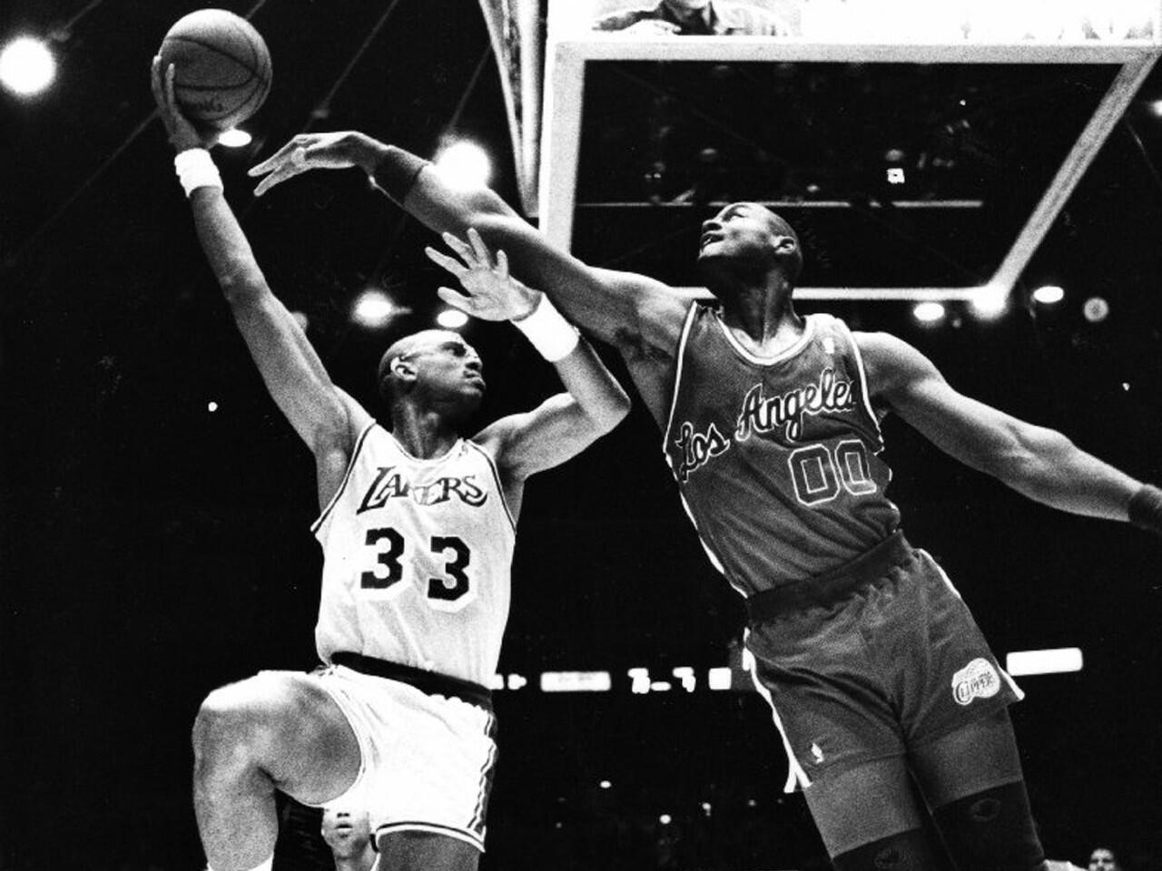 Lakers center Kareem Abdul-Jabbar shoots a sky hook over Clippers center Benoit Benjamin in a 29-point Lakers' blowout in 1987.