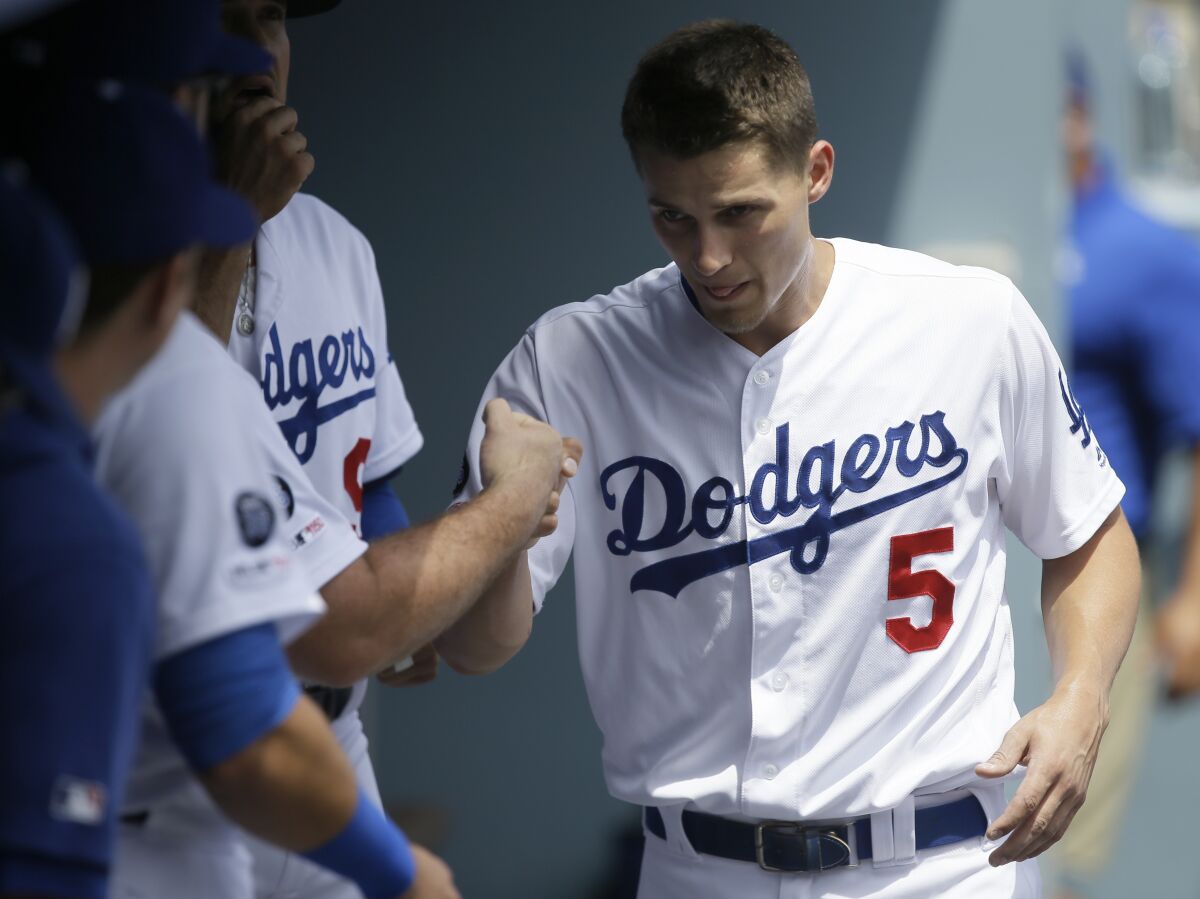 Dodgers shortstop Corey Seager greets teammates before Wednesday's game against the Cardinals.