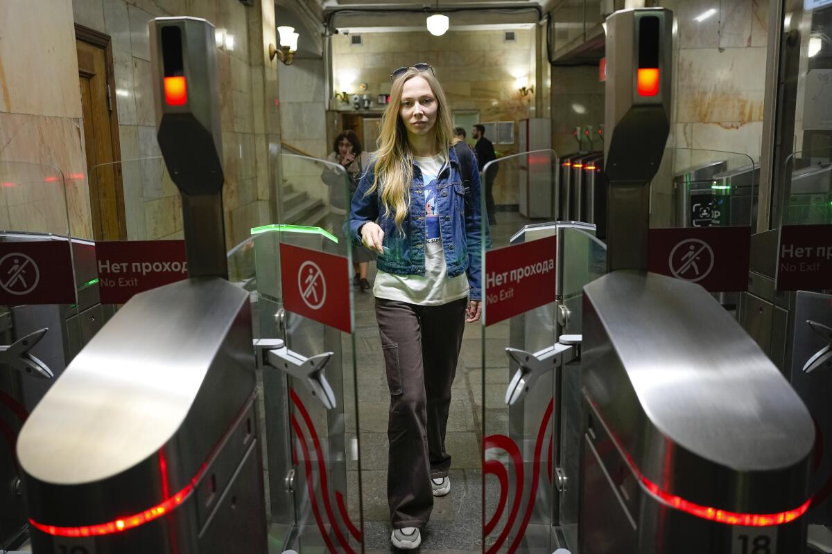 Woman entering a Moscow subway station