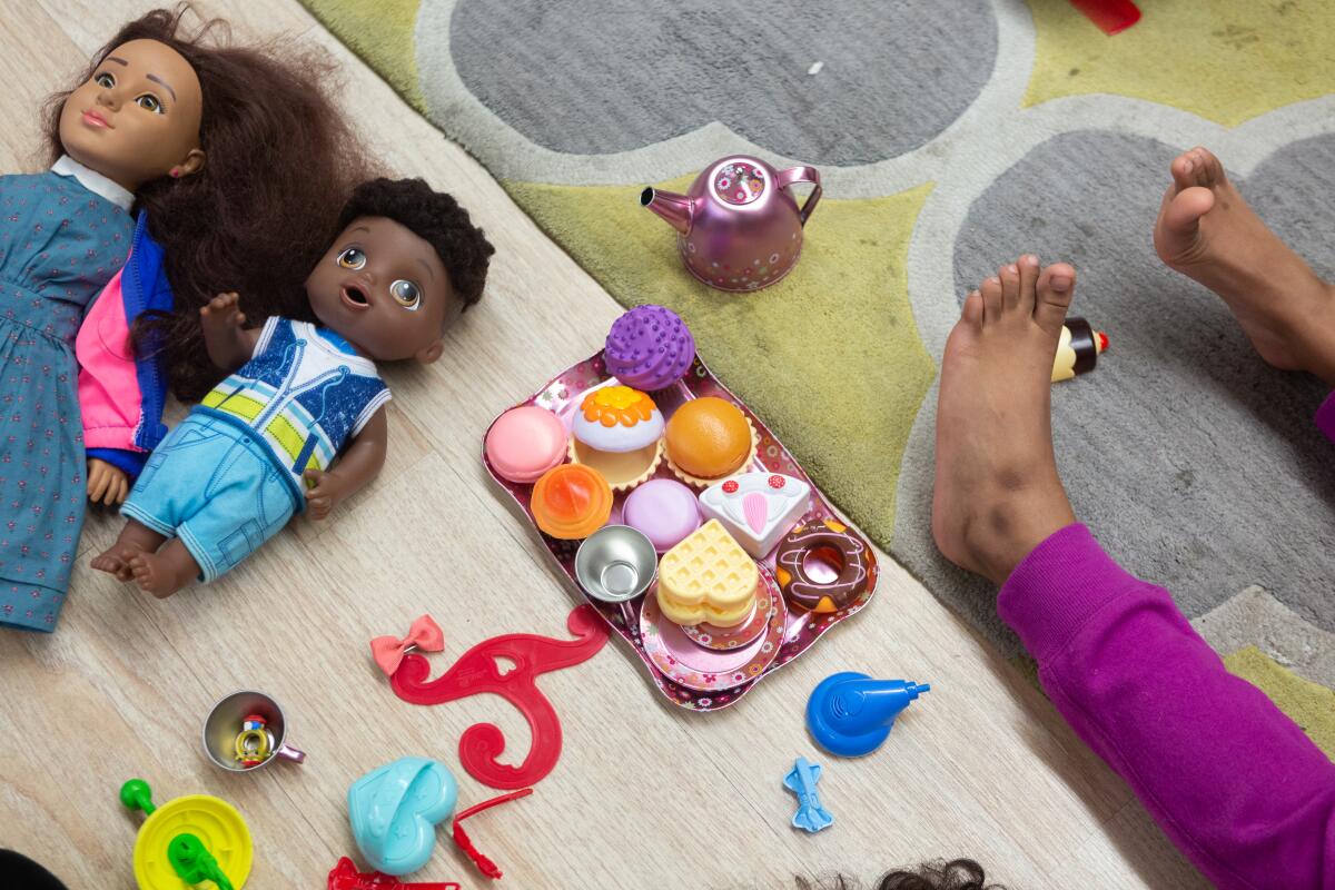 Crete Academy students groom their dolls during group therapy at Crete Academy in South Los Angeles. 