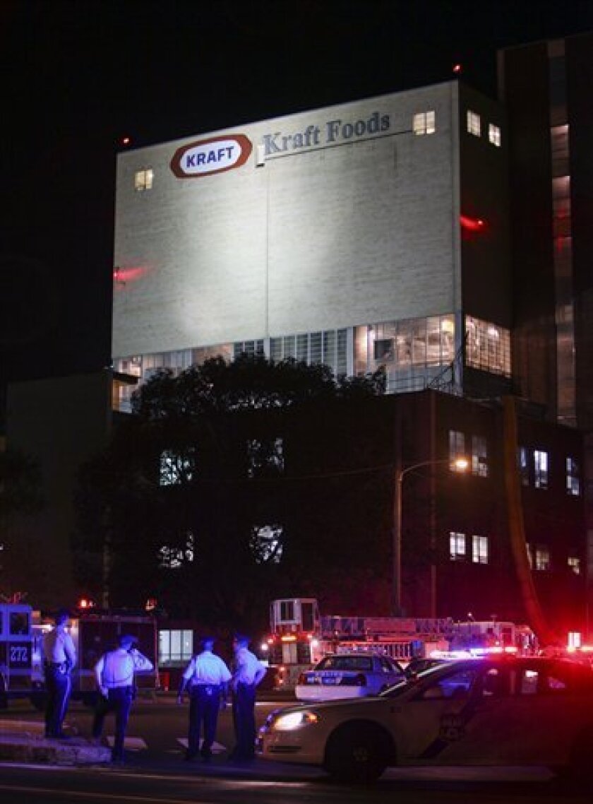 Police gather at the scene of a workplace shooting at the Kraft Foods Inc. facility in Northeast Philadelphia on Thursday Sept. 9, 2010. (AP Photo/ Joseph Kaczmarek)