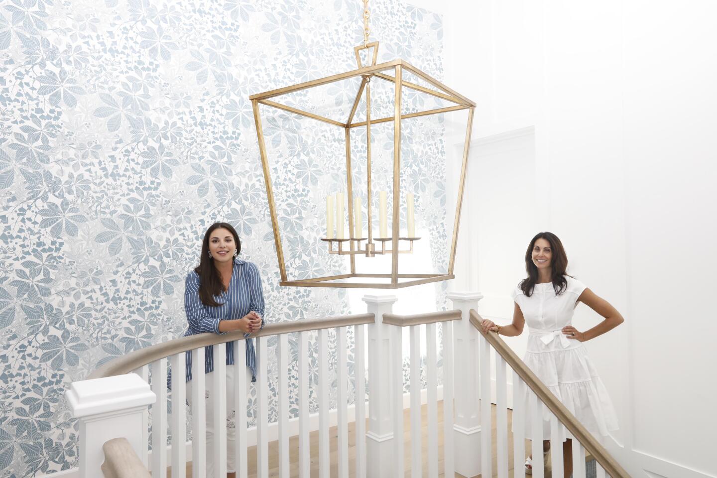 Victoria Aveyard, author of the young adult fantasy series, "Red Queen," left, and interior decorator Christine Markatos Lowe, who helped her create young, feminine interiors with pastel colors, whimsical wallpapers and eclectic furnishings.