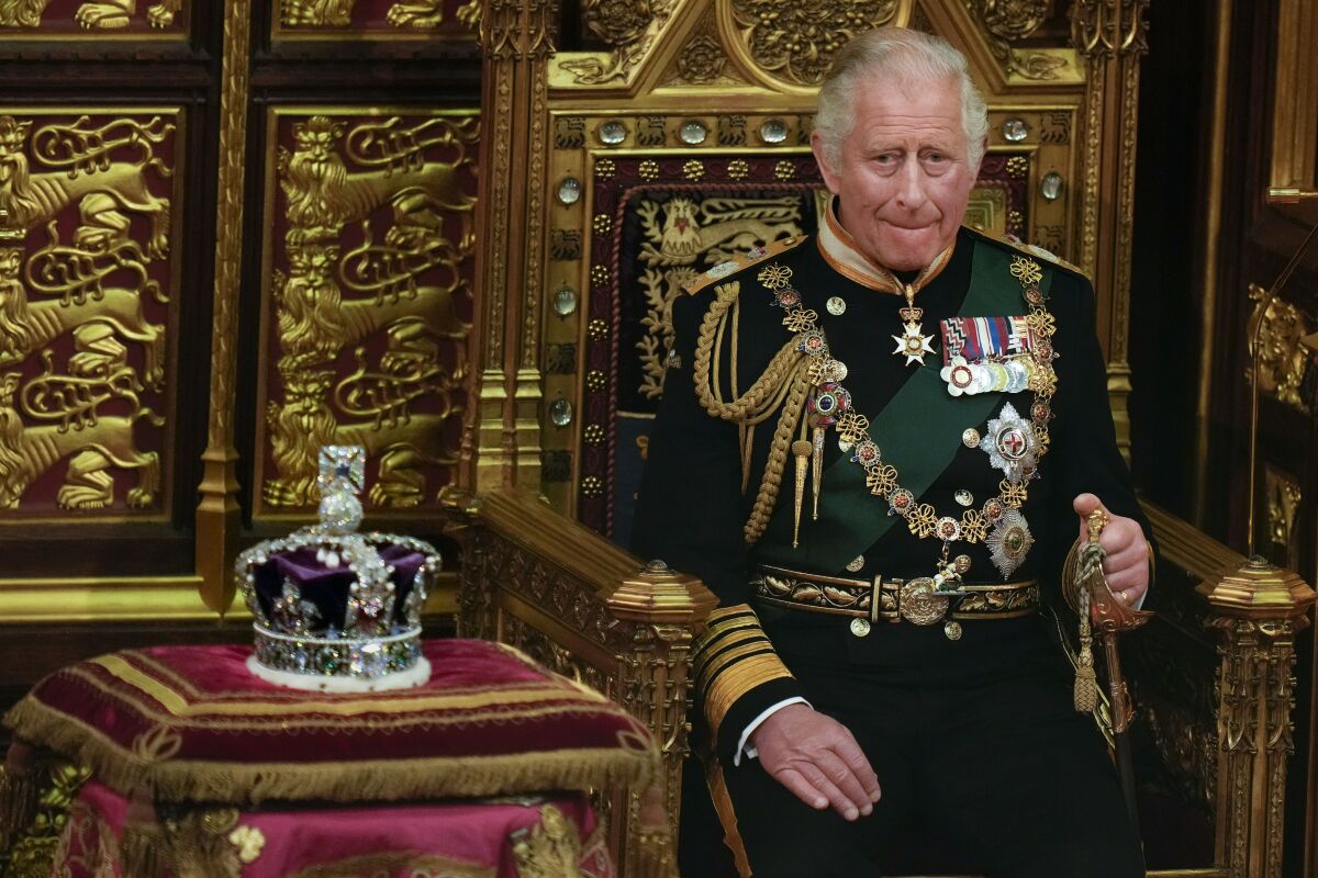 Prince Charles is seated next to the Queen's crown during the State Opening of Parliament on May 10, 2022. 