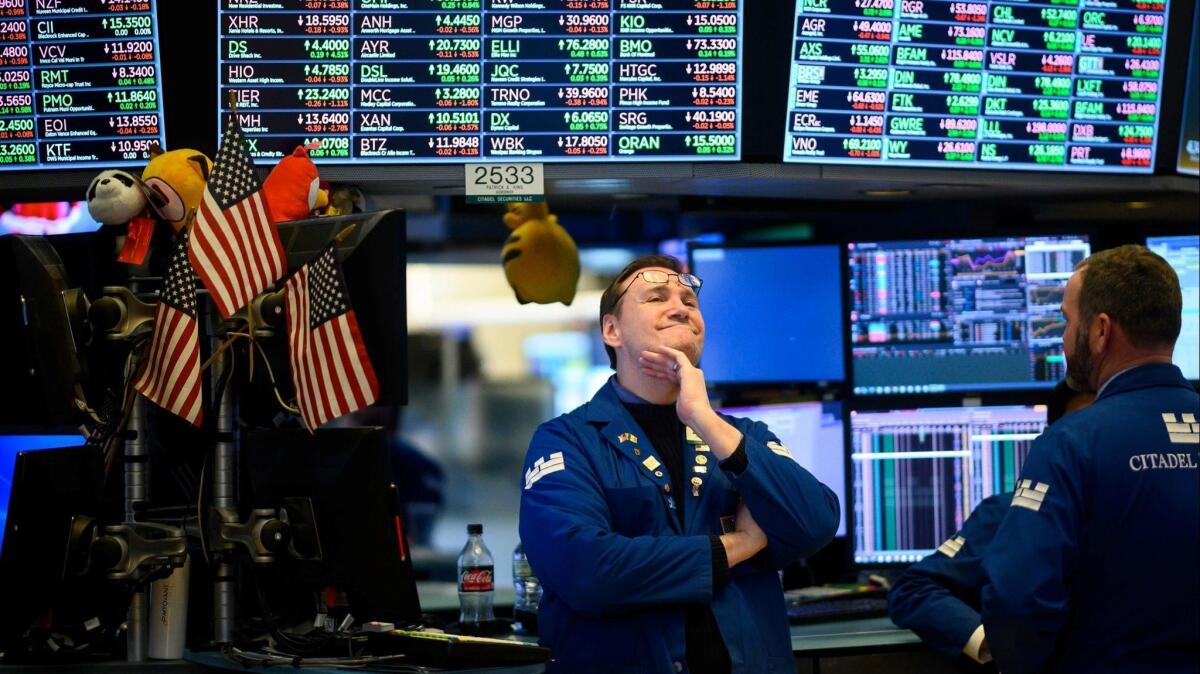Traders work on the floor of the New York Stock Exchange on Feb. 1.