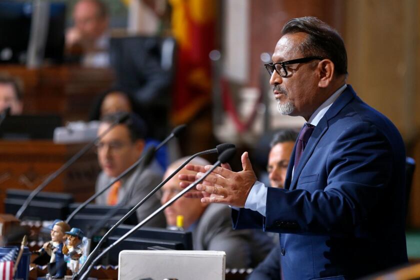 LOS ANGELES, CALIF. -- WEDNESDAY, JUNE 28, 2017: Councilmember Gil Cedillo questions members of the Department of Water and Power (DWP) Board of Water and Power Commissioners before the city council voted 11-3 to approve a pay increase over 5 years for 9,000 union workers from the Department of Water and Power at Los Angeles City Hall Wednesday, June 28, 2017. The contract was opposed by some neighborhood activists who argued that it was rushed through without enough scrutiny. (Allen J. Schaben / Los Angeles Times)