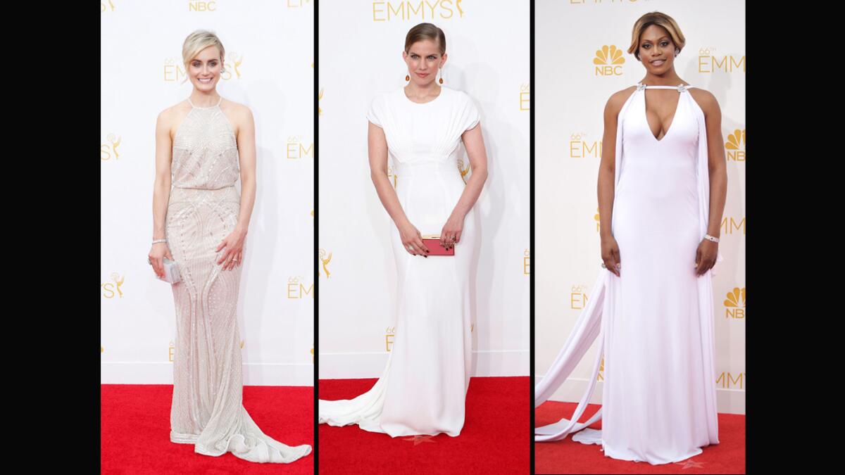Actresses Taylor Schilling, from left, Anna Chlumsky and Laverne Cox go for the glow of white gowns.