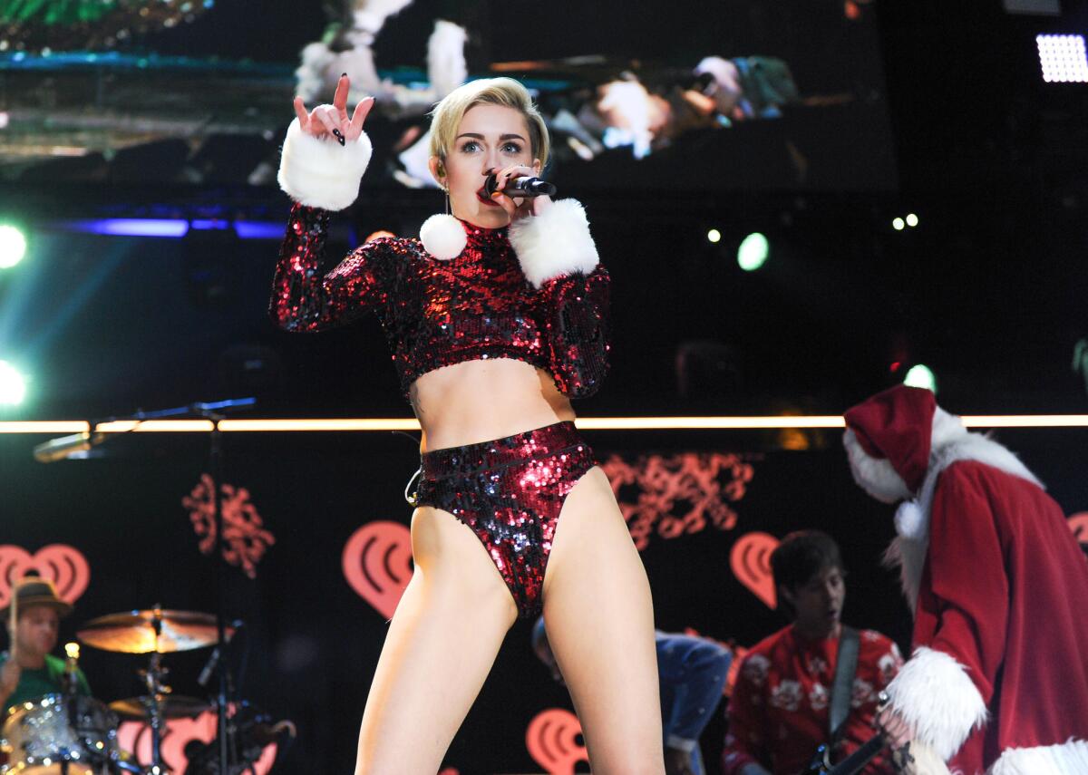 Singer Miley Cyrus performs at Jingle Ball 2013 at Madison Square Garden.