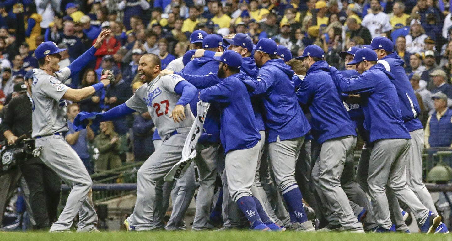 The Dodgers celebrate a 5-1 win over the Brewers in game seven.