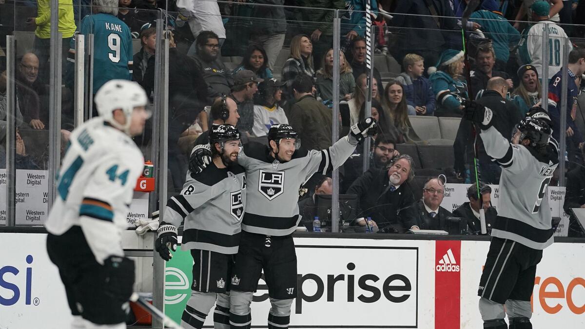 Kings left wing Ilya Kovalchuk celebrates with teammates Drew Doughty (8) and Adrian Kempe (9) after scoring against the San Jose Sharks in overtime.