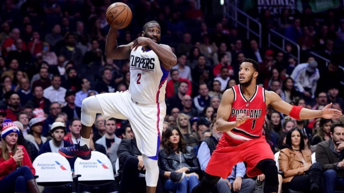 Clippers guard Raymond Felton shows defensive skills by intercepting a pass intended for Portland's Evan Turner.