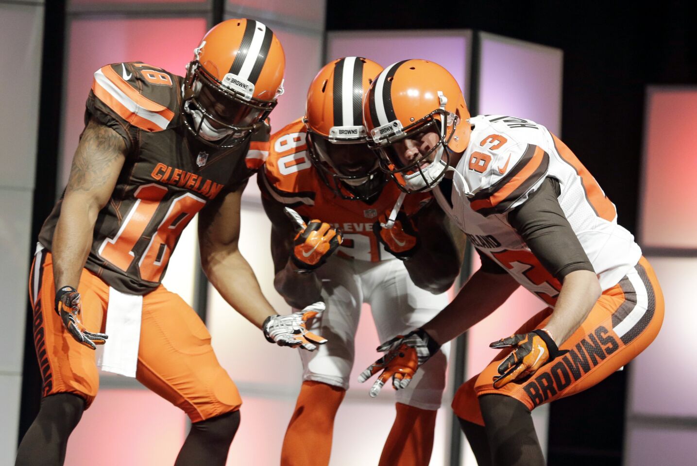 Browns receivers Taylor Gabriel, left, Dwayne Bowe and Brian Hartline model Cleveland's new uniforms designed by Nike for the 2015 season and beyond.