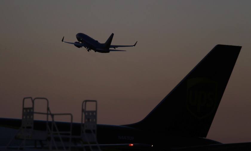 A plane takes off from John Wayne Airport.