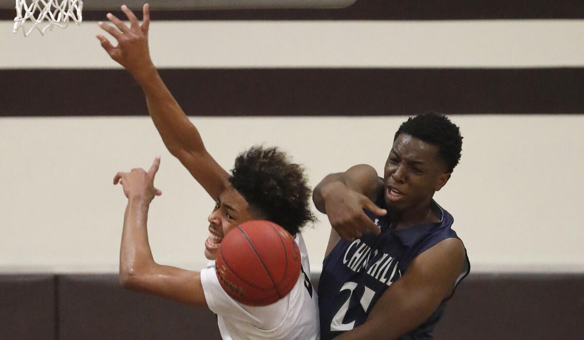 Chino Hills' Onyeka Okongwu blocks a shot by Crespi's Kyle Owens during a game last season.