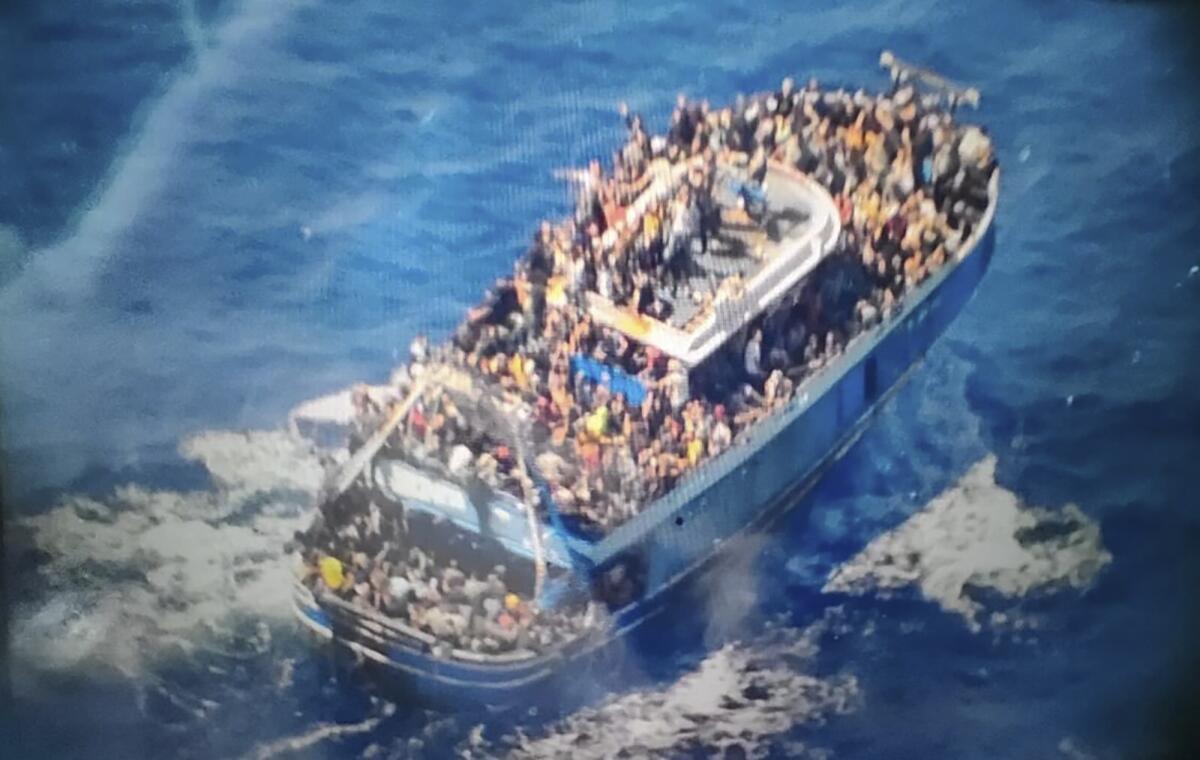A boat packed with hundreds of migrants that would go on to capsize in the Mediterranean Sea. 