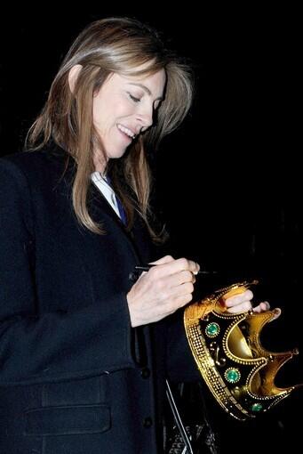 "The Hurt Locker" director signs a crown backstage after accepting the award for outstanding director of the year.