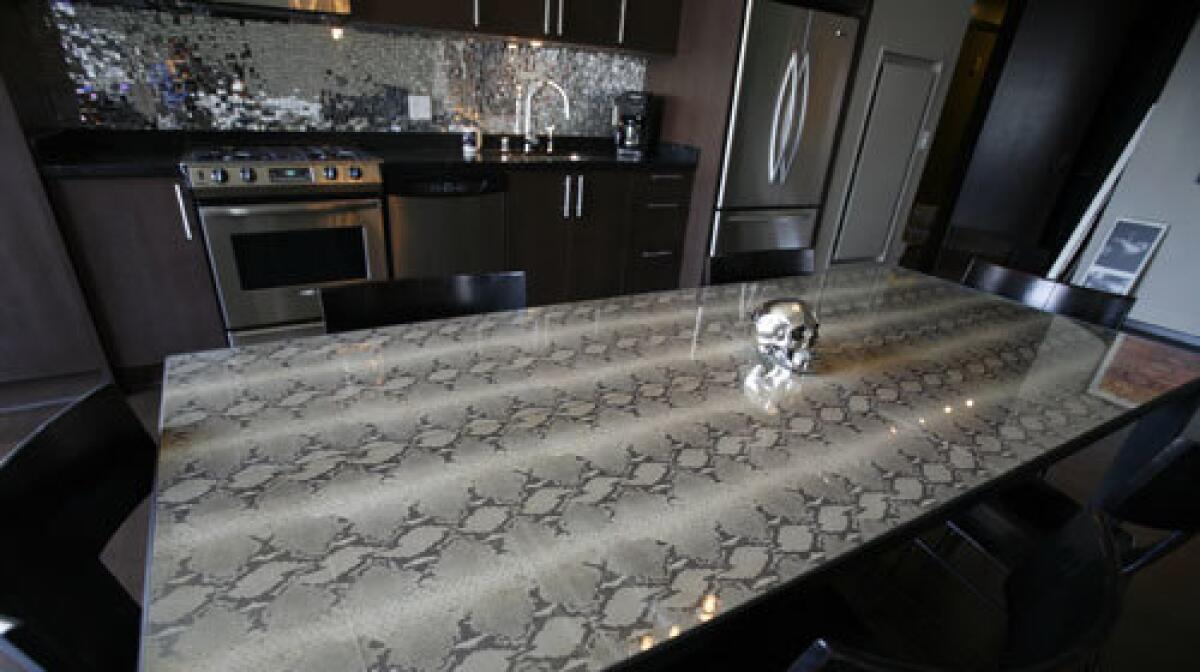 A silver skull is the centerpiece of a snakeskin dining table in Dave Navarro's Hollywood loft.
