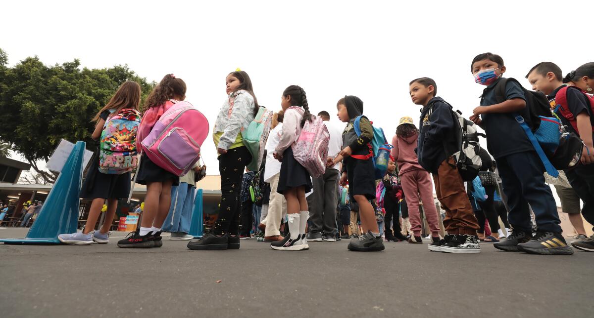 Students form lines outside Weemes Elementary School in South Los Angeles.