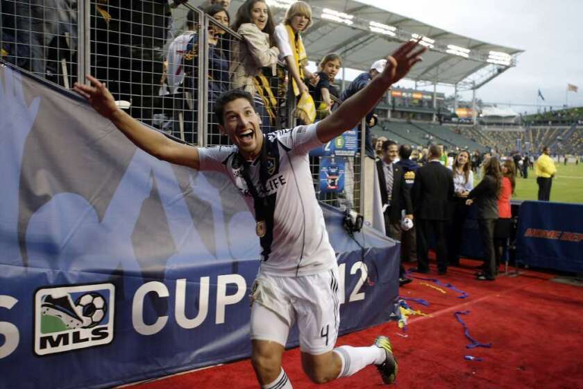 Galaxy defender Omar Gonzalez reacts to fans during a game.