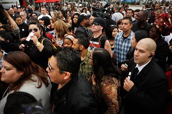 Ticket holders to Michael Jackson's public memorial line up early at the corner of 11th and Flower streets near Staples Center.