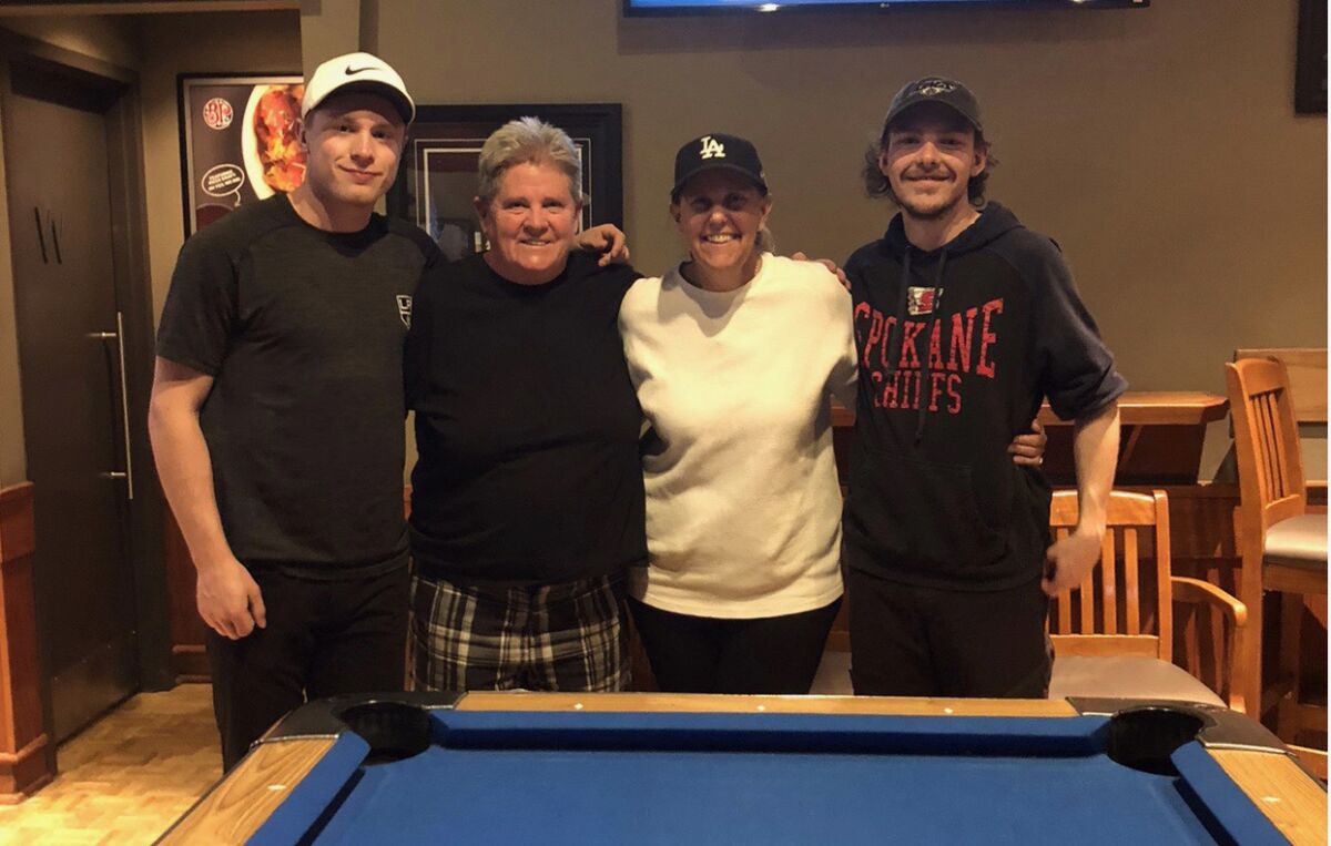 From left to right, Kings hockey player Jaret Anderson-Dolan, his two moms, Fran and Nancy, and brother, Dorian.