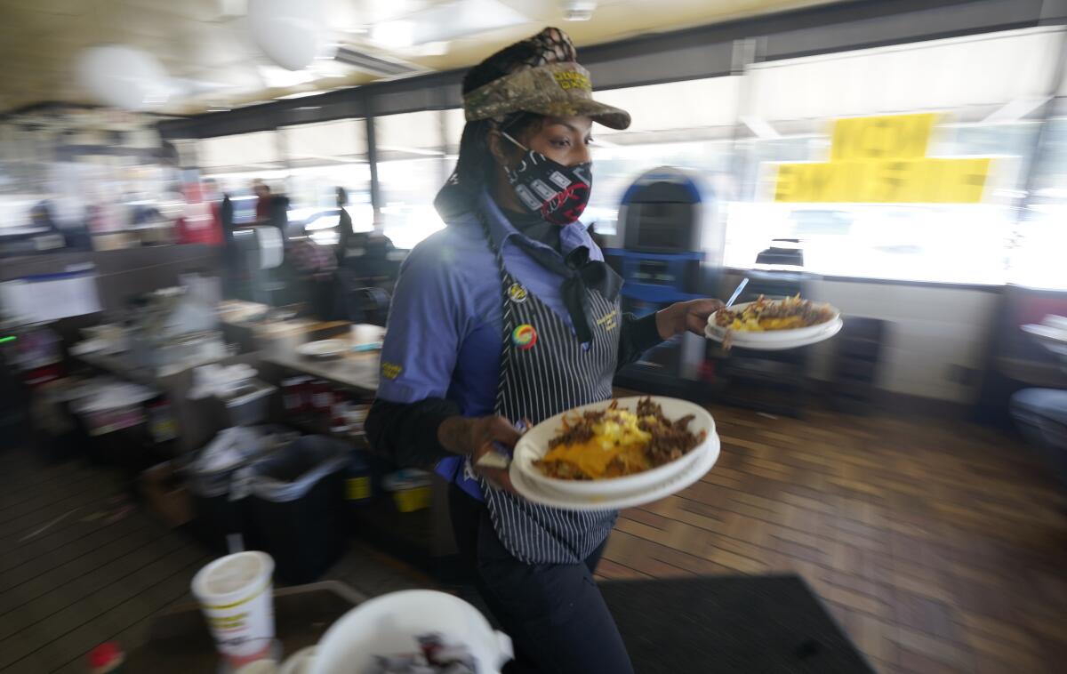 Alexia Calton serves breakfast in Richardson, Tex. 