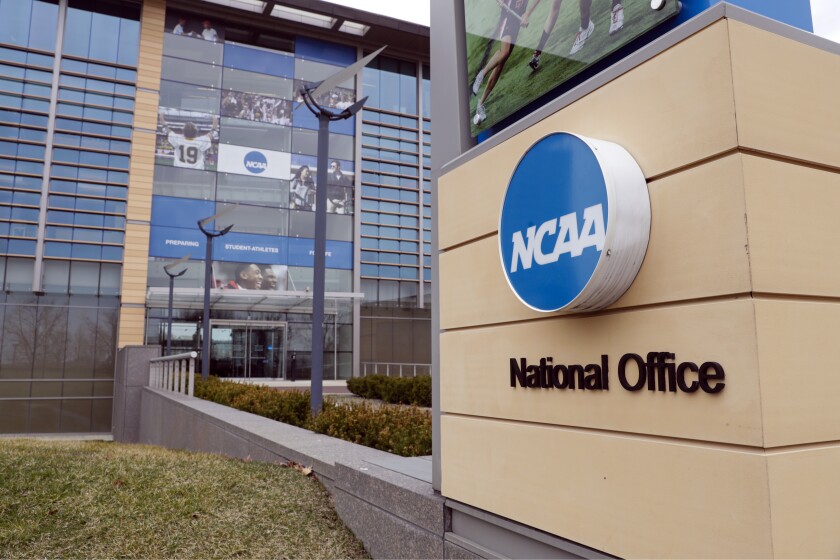 FILE - The national office of the NCAA in Indianapolis is shown on March 12, 2020. NCAA enforcement has inquired about how college athletes are earning money off their names, images and likenesses at multiple schools as it attempts to police activities that are ungoverned by detailed and uniform rules. NCAA Vice President of Enforcement Jon Duncan told the Associated Press that letters of inquiry have gone out over the last few months. (AP Photo/Michael Conroy, File)
