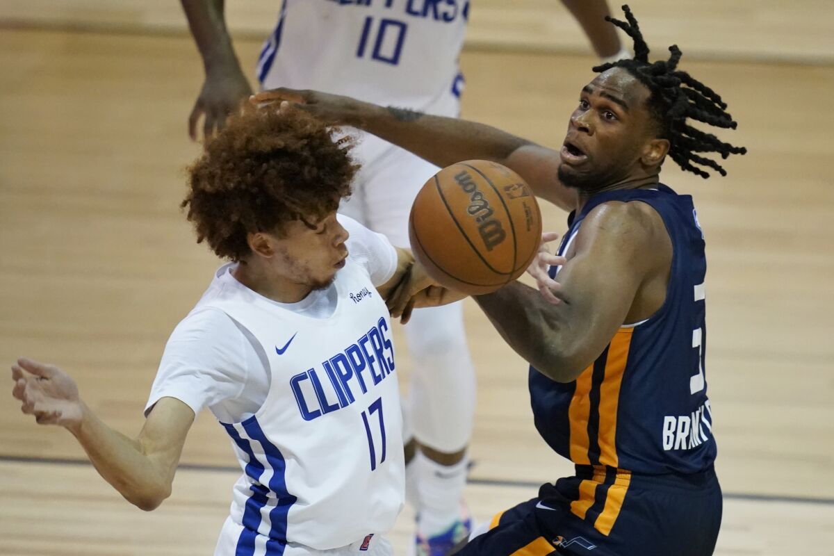 Clippers guard Jason Preston defends against the Jazz's Jarrell Brantley.